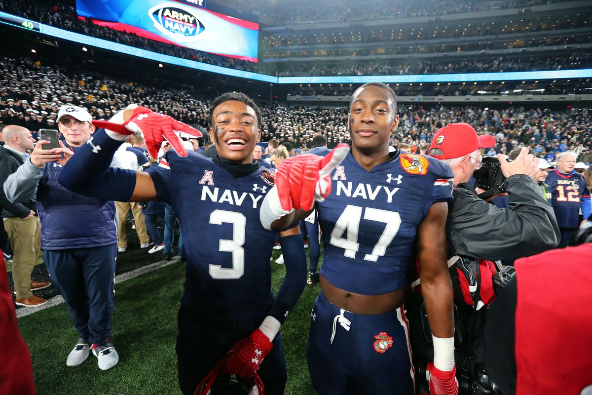 &nbsp;East Rutherford, New Jersey, USA; Navy Midshipmen wide receiver Mychal Cooper and linebacker Tyler Fletcher celebrate after a 17-13 win against the Army Black Knights in the 122nd Army-Navy game.