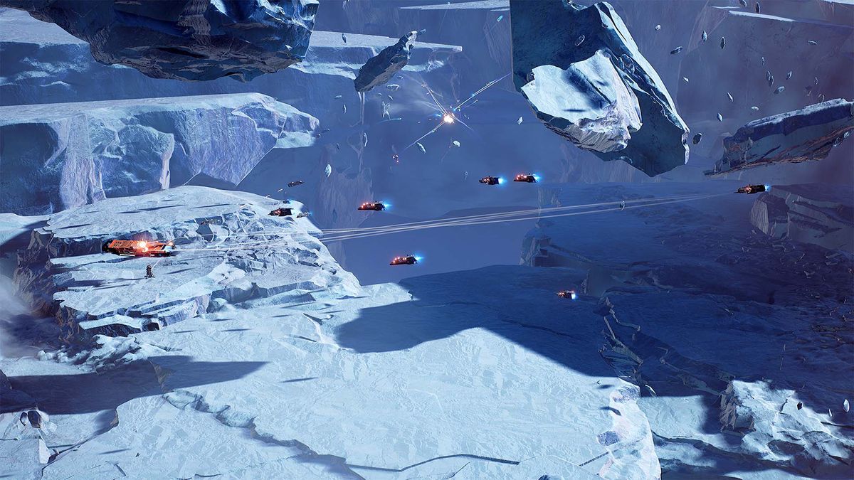 Fighters stream across an icy planet, debris surrounding a pitched battle inside a crater.