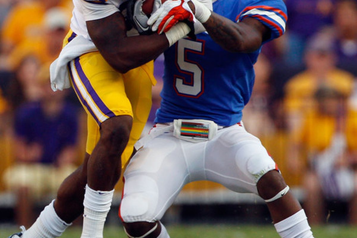 BATON ROUGE, LA - OCTOBER 08:  Kadron Boone #86 of the Louisiana State University Tigers is tackled by Marcus Roberson #5 of the Florida Gators at Tiger Stadium on October 8, 2011 in Baton Rouge, Louisiana.  (Photo by Chris Graythen/Getty Images)