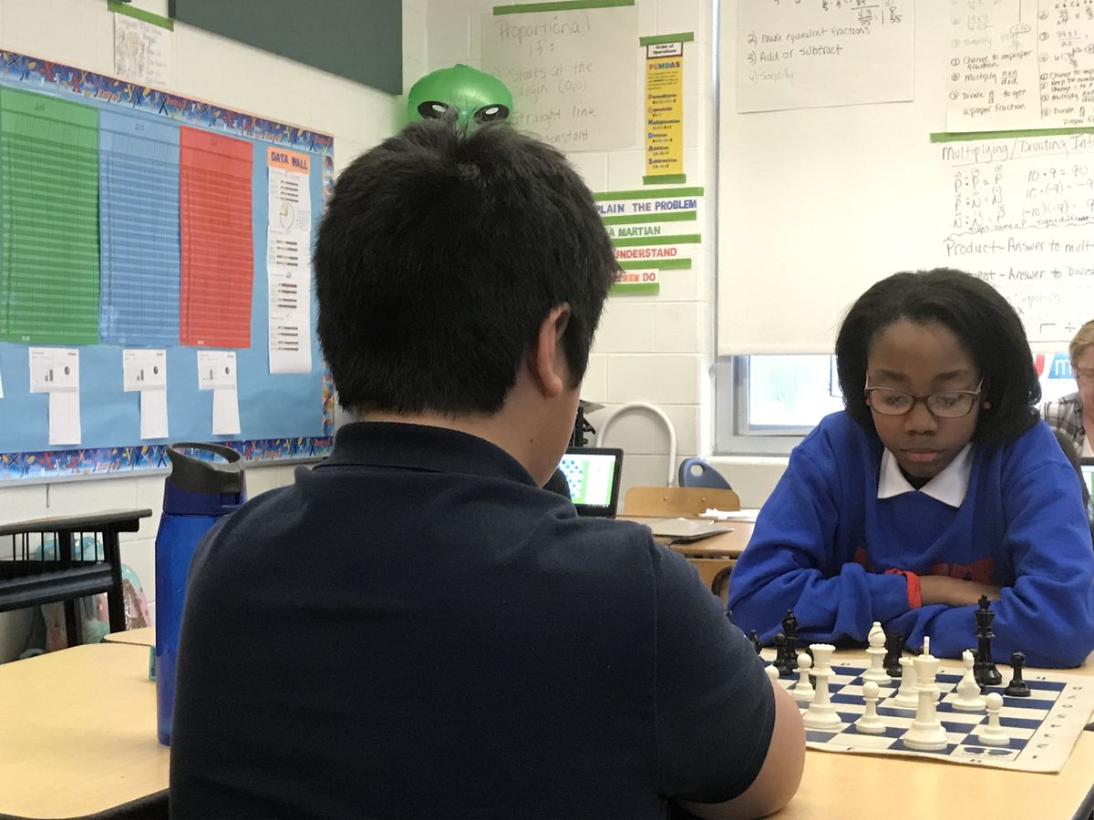 Kelsey Gibbs, 12, a seventh-grader at Munger Elementary-Middle School in Detroit, plays a game of chess with a teammate Tuesday.