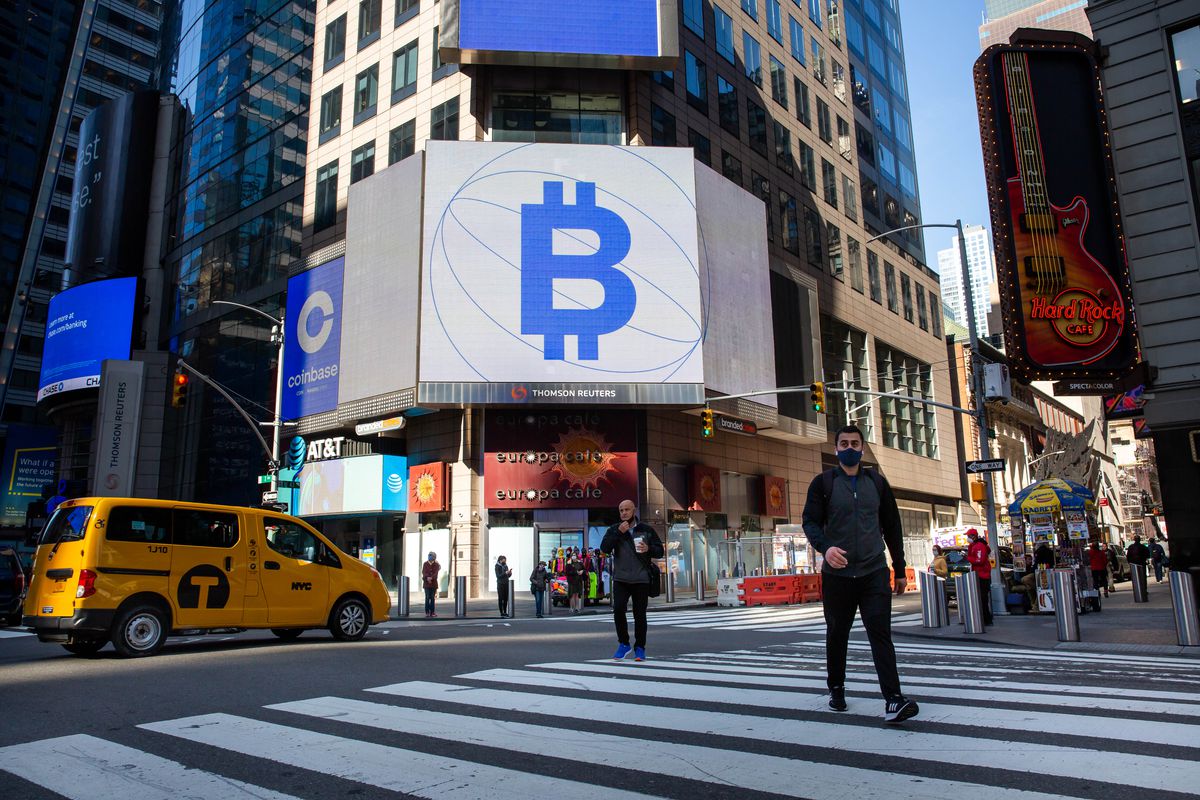 A digital sign outside the Nasdaq building in New York displays a bitcoin symbol that resembles a capital B combined with a dollar sign.