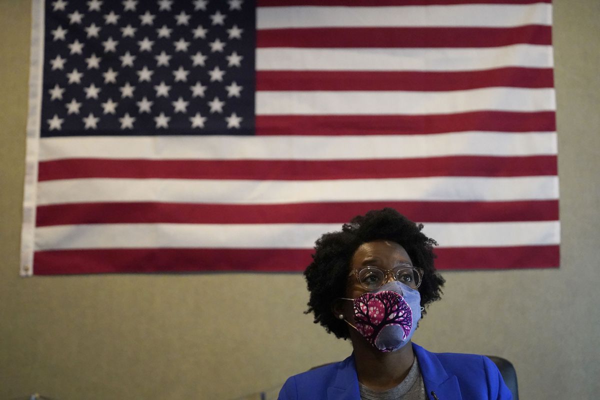 Congresswoman Lauren Underwood watches National Election Results on the TV at an election night headquarter in St. Charles, Ill., Tuesday, Nov. 3, 2020. AP called the race for Underwood on Thursday, Nov. 12.. (AP Photo/Nam Y. Huh) ORG XMIT: ILNH105