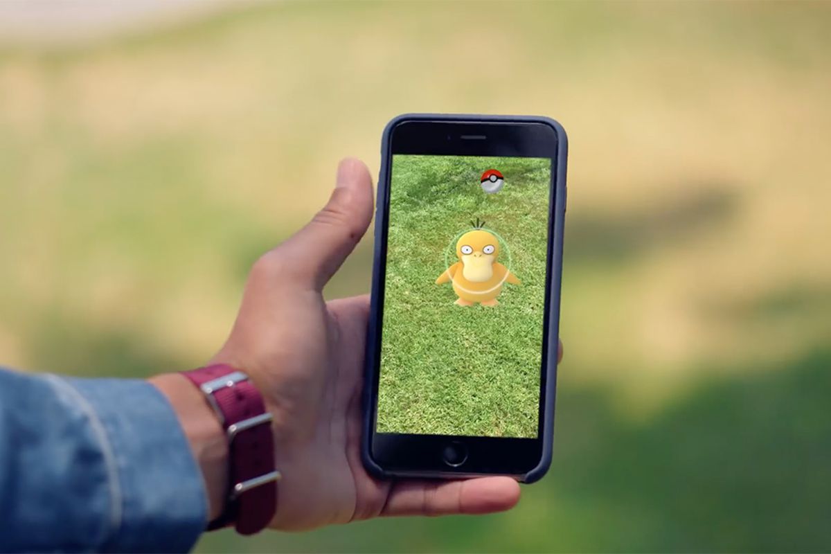 A player catches a Psyduck using AR mode in Pokémon Go