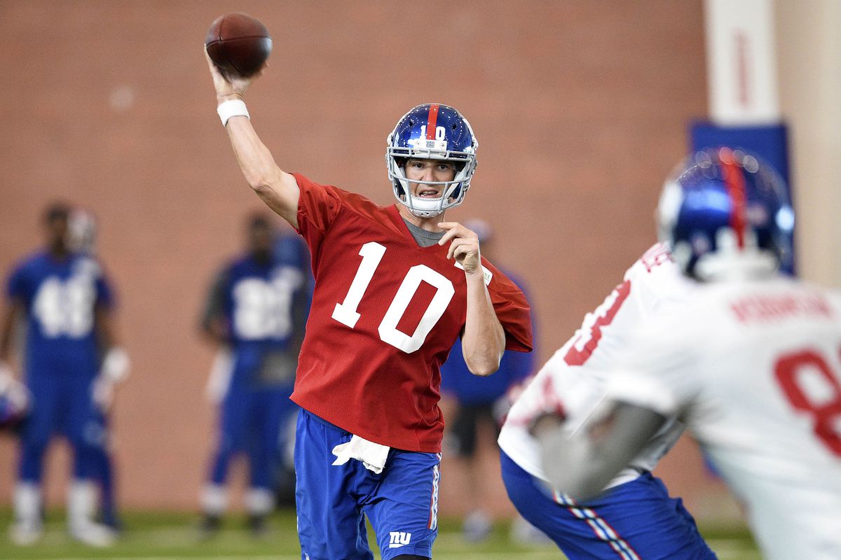 Eli Manning throws a pass during mini-camp.