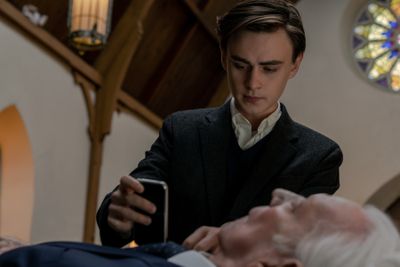 A photo of Jaeden Martell and Donald Sutherland in the Netflix film Mr. Harrigan’s Phone.
