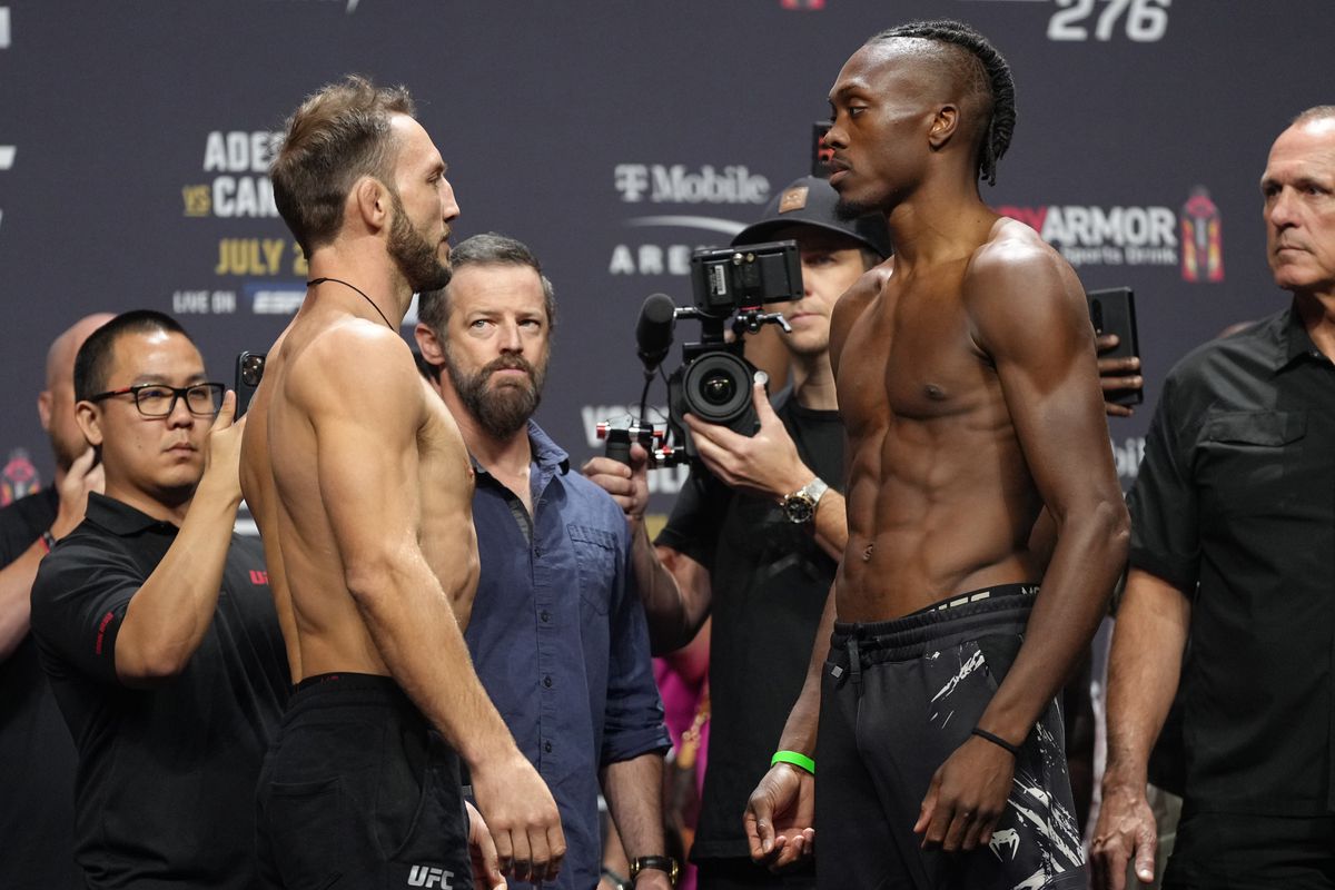 Opponents Brad Riddell of New Zealand and Jalin Turner face off during the UFC 276 ceremonial weigh-in at T-Mobile Arena on July 01, 2022 in Las Vegas, Nevada.