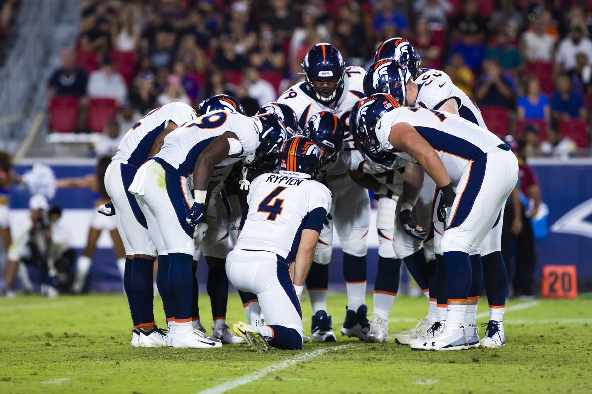Denver Broncos quarterback Brett Rypien (4) in an offensive group huddle during an NFL preseason football game against the Los Angeles Rams on August 24, 2019 at the Los Angeles Memorial Coliseum in Los Angeles, Calif.