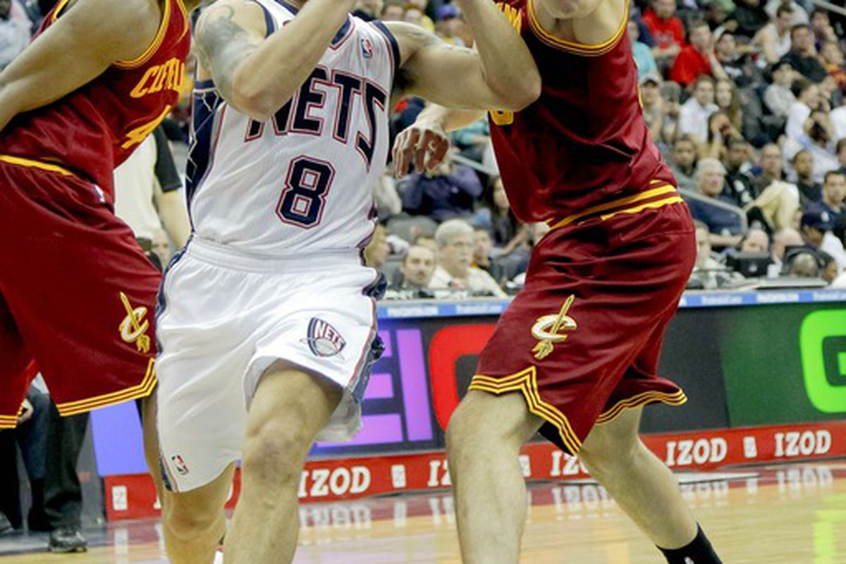 Mar 19, 2012; Newark, NJ, USA;  New Jersey Nets point guard Deron Williams (8) drives to the basket against Cleveland Cavaliers small forward Omri Casspi (36) during the first half at the Prudential Center. Mandatory Credit: Jim O'Connor-US PRESSWIRE