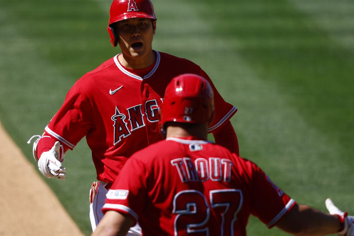 Shohei Ohtani of the Los Angeles Angels celebrates a home run with Mike Trout against the Chicago White Sox in the ninth inning at Angel Stadium of Anaheim on June 29, 2023 in Anaheim, California.