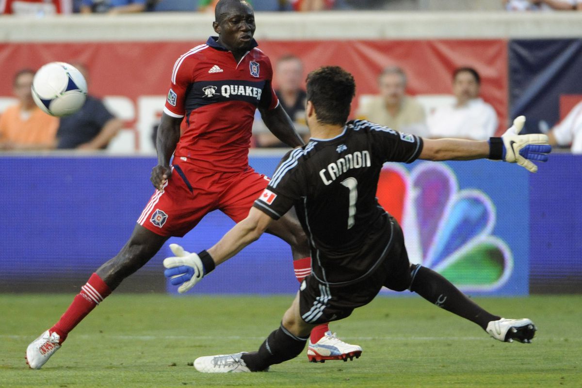 BRIDGEVIEW, IL - JULY 14: Joe Cannon #1 of the Vancouver Whitecaps makes a save against Dominic Oduro #8 of the Chicago Fire in an MLS match on July 14, 2012 at Toyota Park in Bridgeview, Illinois.   (Photo by David Banks/Getty Images)