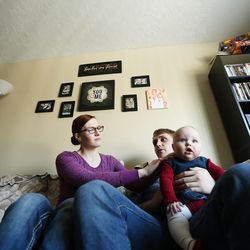 Michael Webster, his wife Kendle and daughter Emery at home in Cottonwood Heights, Tuesday, Dec. 20, 2016. The couple talks about their lives, moving and jobs as the Census Bureau reports that Utah is the Nation's fastest growing state.