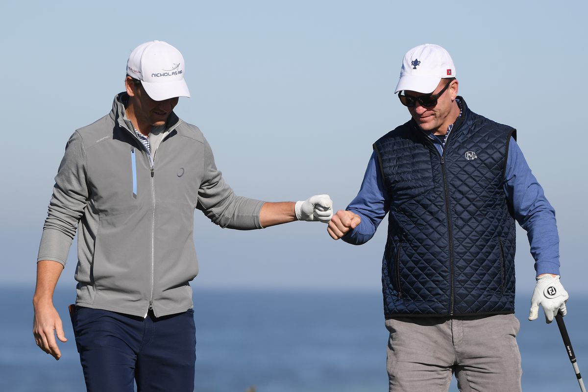 Former NFL players Eli and Peyton Manning celebrate during the second round of the AT&amp;T Pebble Beach Pro-Am at Monterey Peninsula Country Club on February 07, 2020 in Pebble Beach, California.