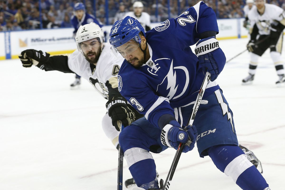The Lightning's J.T. Brown works against Pittsburgh's Justin Schultz in Tampa Bay's 4-3 win in Tampa Friday night.