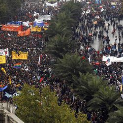 Chilean students march through the streets demanding free education, in Santiago, Chile, Thursday, April. 11, 2013.  The marches began during the 2006-2010 Michelle Bachelet administration and have troubled President Sebastian Pinera even more. Pinera's government is focusing a chunk of the 2013 budget on financing school loans at lower rates. But students say the system still fails them, with poor public schools, expensive private universities, unprepared teachers and unaffordable loans. (AP Photo/Luis Hidalgo)