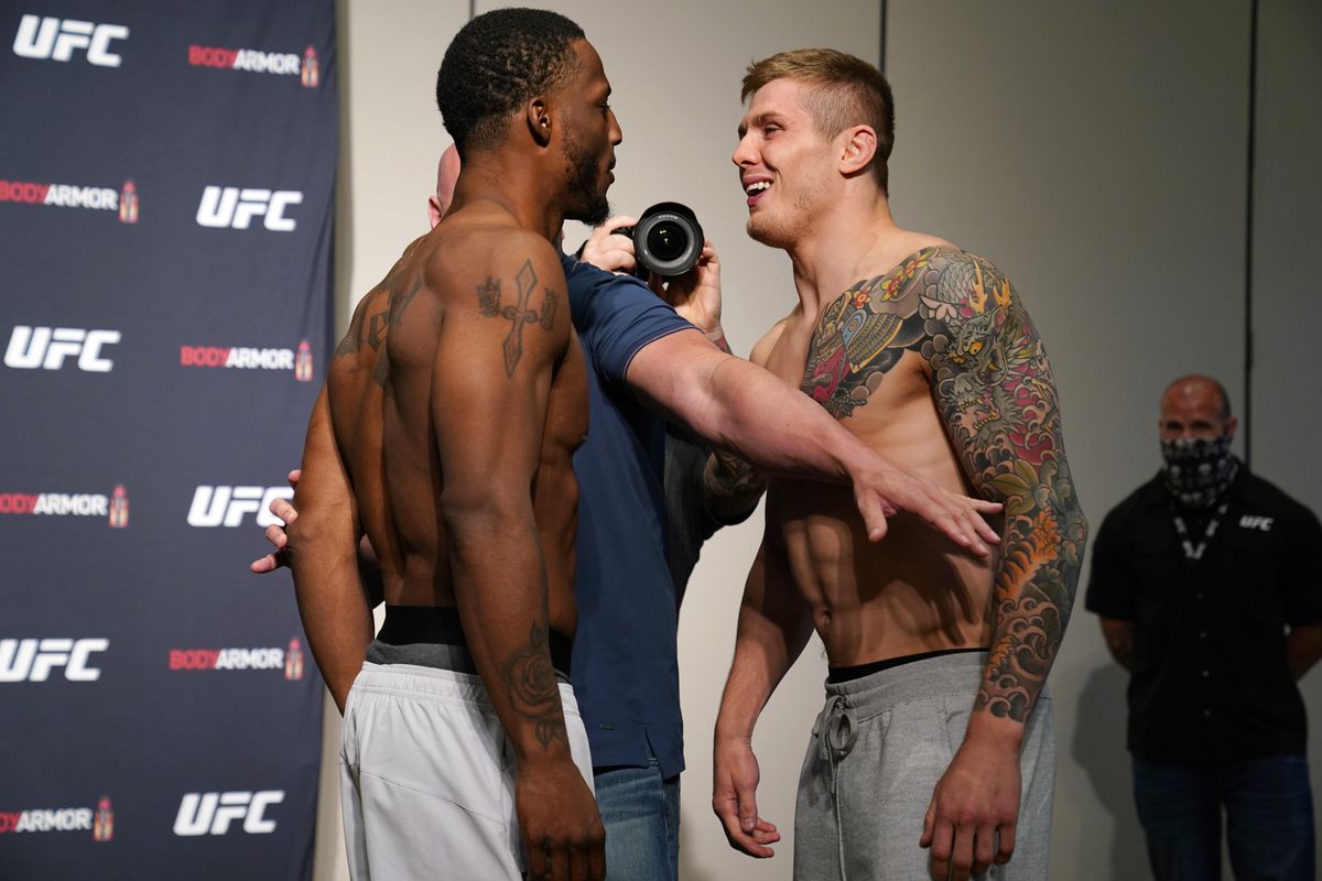 Opponents Karl Roberson and Marvin Vettori of Italy face off during the official UFC Fight Night weigh-in on May 12, 2020 in Jacksonville, Florida.