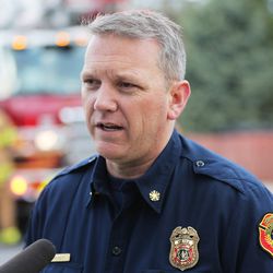 South Davis Metro Fire Chief Jeff Bassett talks with media as firefighters respond to a structure fire in Bountiful, Thursday, March 17, 2016.