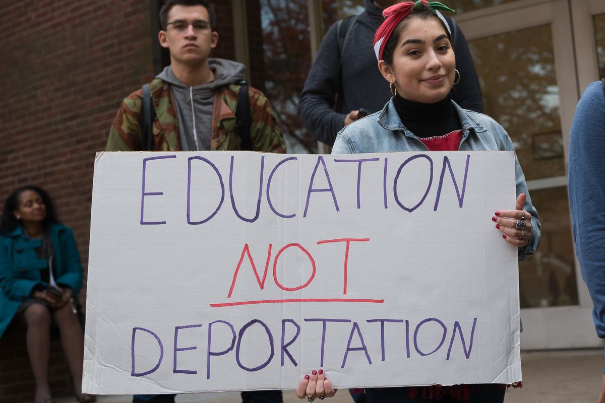 Photo showing a university student advocating for education for undocumented immigrants and not deportation