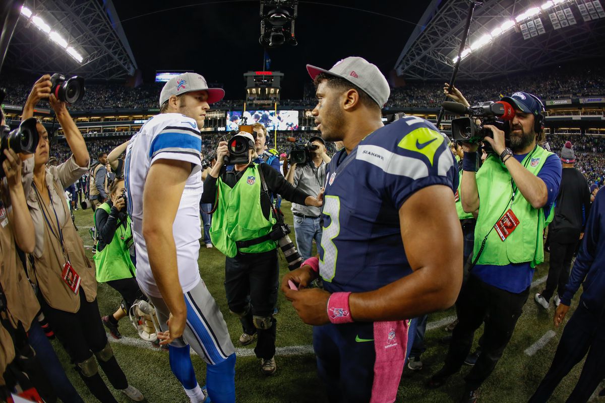 Quarterback Russell Wilson #3 (R) of the Seattle Seahawks is congratulated by quarterback Matthew Stafford #9 of the Detroit Lions after the Seahawks defeated the Lions 13-10 at CenturyLink Field on October 5, 2015 in Seattle, Washington.