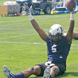 Utah State wide receiver Jaren Colston-Green celebrates on the ground in the end zone after hauling in a pass for a touchdown during the Aggies' practice Friday afternoon in Logan.