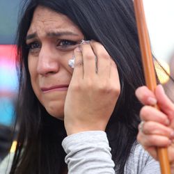 Catalina Cardona cries during a vigil for the victims and survivors of the mass shooting at a gay nightclub in Orlando, Florida, outside of the Salt Lake City-County Building on Monday, June 13, 2016.