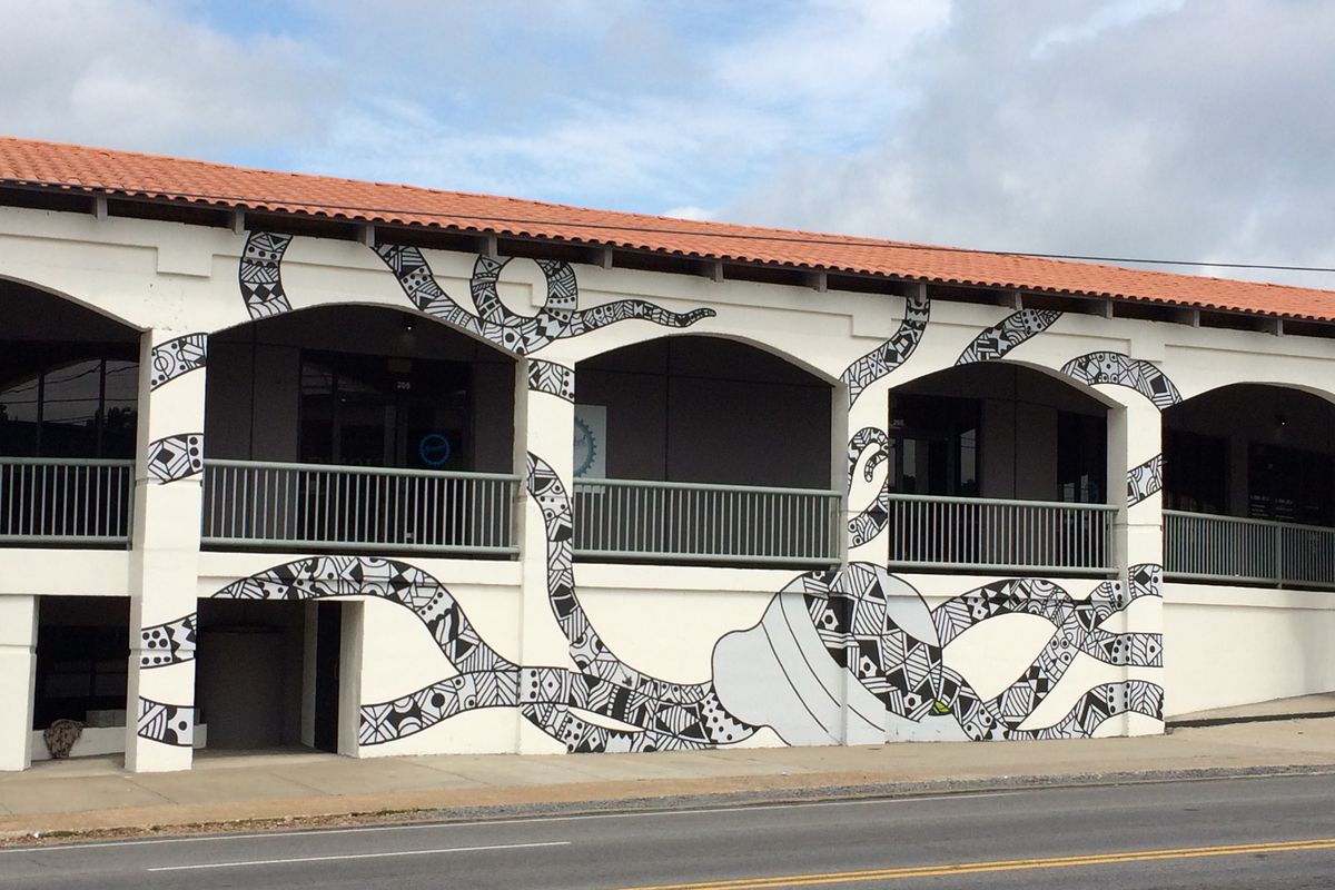 A new 50 by 20 foot octopus mural on the exterior of POP's building.