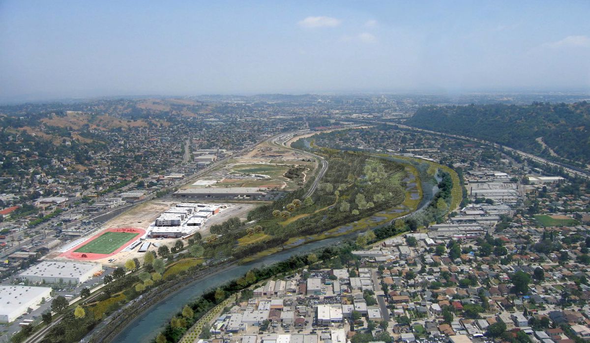 An aerial view of the Taylor Yard G2 parcel in Los Angeles, California. There is a river and on both sides of the river are many houses, buildings, schools, and parks.