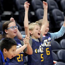 Kai Johnson, Paige Zimmerman, Isaac Wardle and Claire Tanner cheer during a game of NBA Math Hoops at the Vivint Smart Home Arena in Salt Lake City on Monday, Jan. 29, 2018.