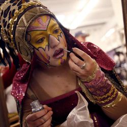 Alex Hancock applies some glitter to her lips before the "Mormon Miracle Pageant" on Friday, June 19, 2009.