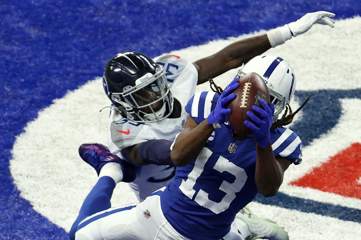 T.Y. Hilton #13 of the Indianapolis Colts catches a touchdown pass in the fourth quarter against Breon Borders #39 of the Tennessee Titans during their game at Lucas Oil Stadium on November 29, 2020 in Indianapolis, Indiana.