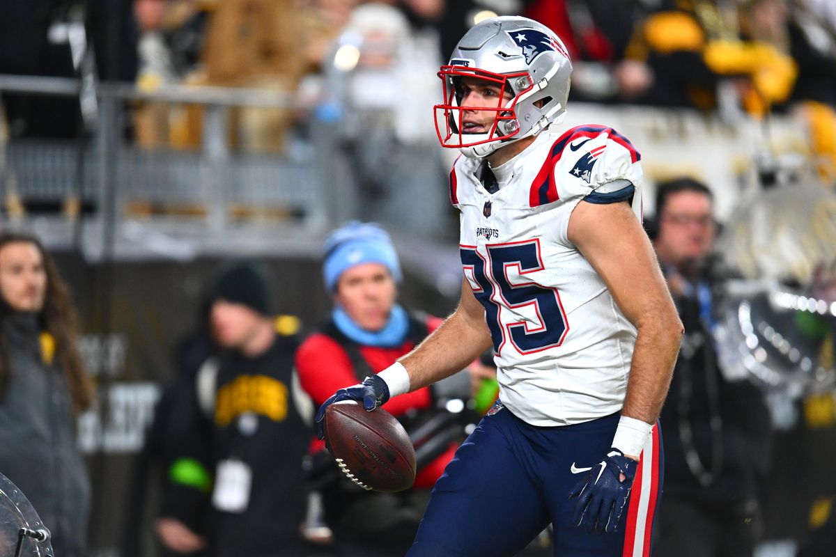 Tight end Hunter Henry (85) of the New England Patriots celebrates after a touchdown reception against the Pittsburgh Steelers at Acrisure Stadium on December 07, 2023 in Pittsburgh, Pennsylvania.