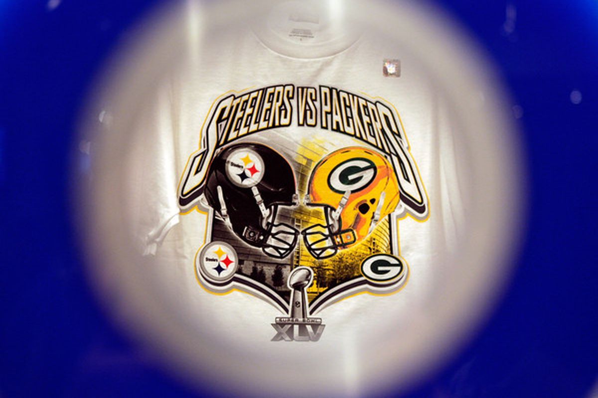 ARLINGTON TX - FEBRUARY 06:  A Pittsburgh Steelers and Green Bay Packers shirt is displayed inside the Pro Shop at Cowboys Stadium before Super Bowl XLV on February 6 2011 in Arlington Texas.  (Photo by Jamie Squire/Getty Images)