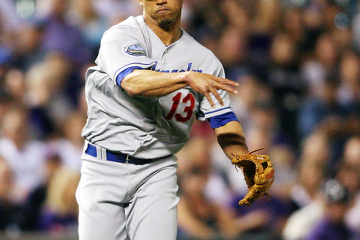 Denver, CO, USA; Former Los Angeles Dodgers third baseman Ivan De Jesus (13) fields a ball during  the sixth inning against the Colorado Rockies at Coors Field.  Mandatory Credit: Chris Humphreys-US PRESSWIRE