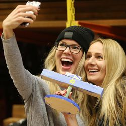 Natalie Stevenett and Andrea Bedke take a selfie as three Jewish communities come together at the Home Depot for a menorah-building workshop in Salt Lake City on Sunday, Dec. 18, 2016.