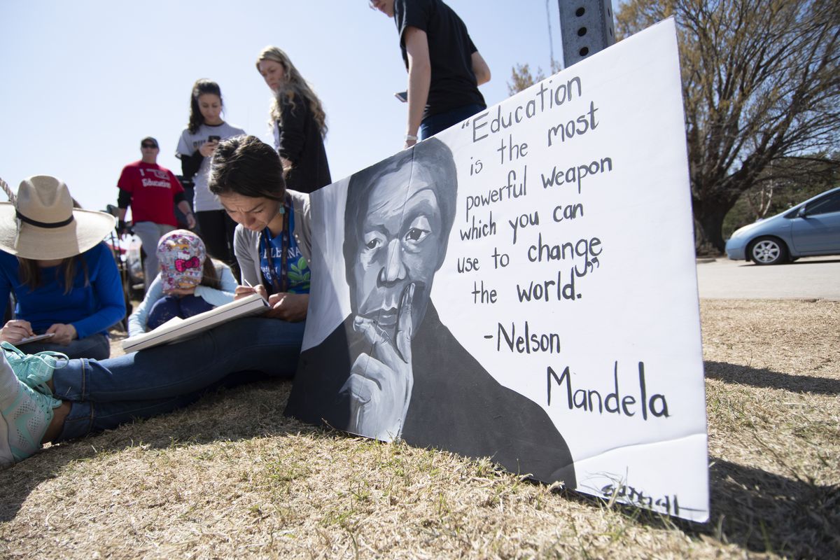 Teacher Laurel Payne, student Aurora Thomas and teacher Elisha Gallegos work on an art project at the state capitol on April 9, 2018 in Oklahoma City, Oklahoma. (Photo by J Pat Carter/Getty Images)