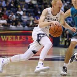 Brigham Young Cougars guard TJ Haws (30) drives against Coastal Carolina Chanticleers guard Artur Labinowicz (2) during a game at the Marriott Center in Provo on Saturday, Nov. 19, 2016. 