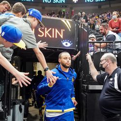 Golden State Warriors guard Stephen Curry exits the tunnel during an NBA game against the Utah Jazz at Vivint Arena in Salt Lake City on Saturday, Jan. 1, 2022.