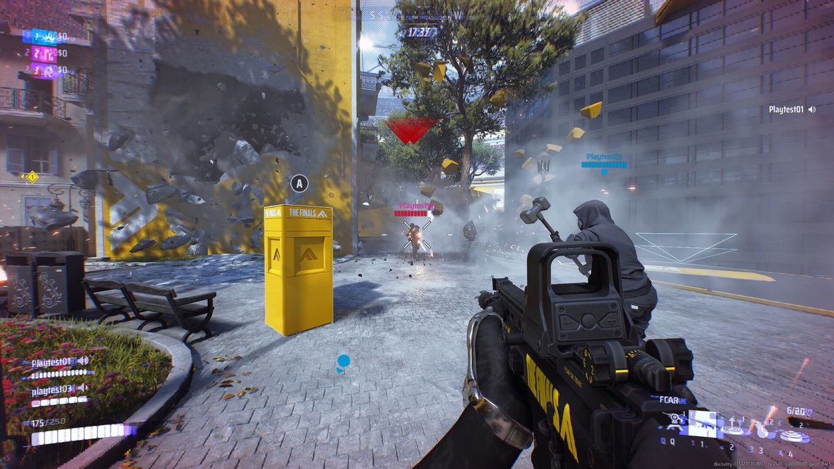 A player in The Finals aims a gun at an opponent as the wall of a building explodes in the background.