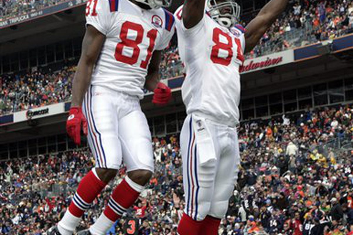 <em>Randy Moss and Ben Watson celebrate a TD against the Broncos in Week 5, before Moss' injury</em>.