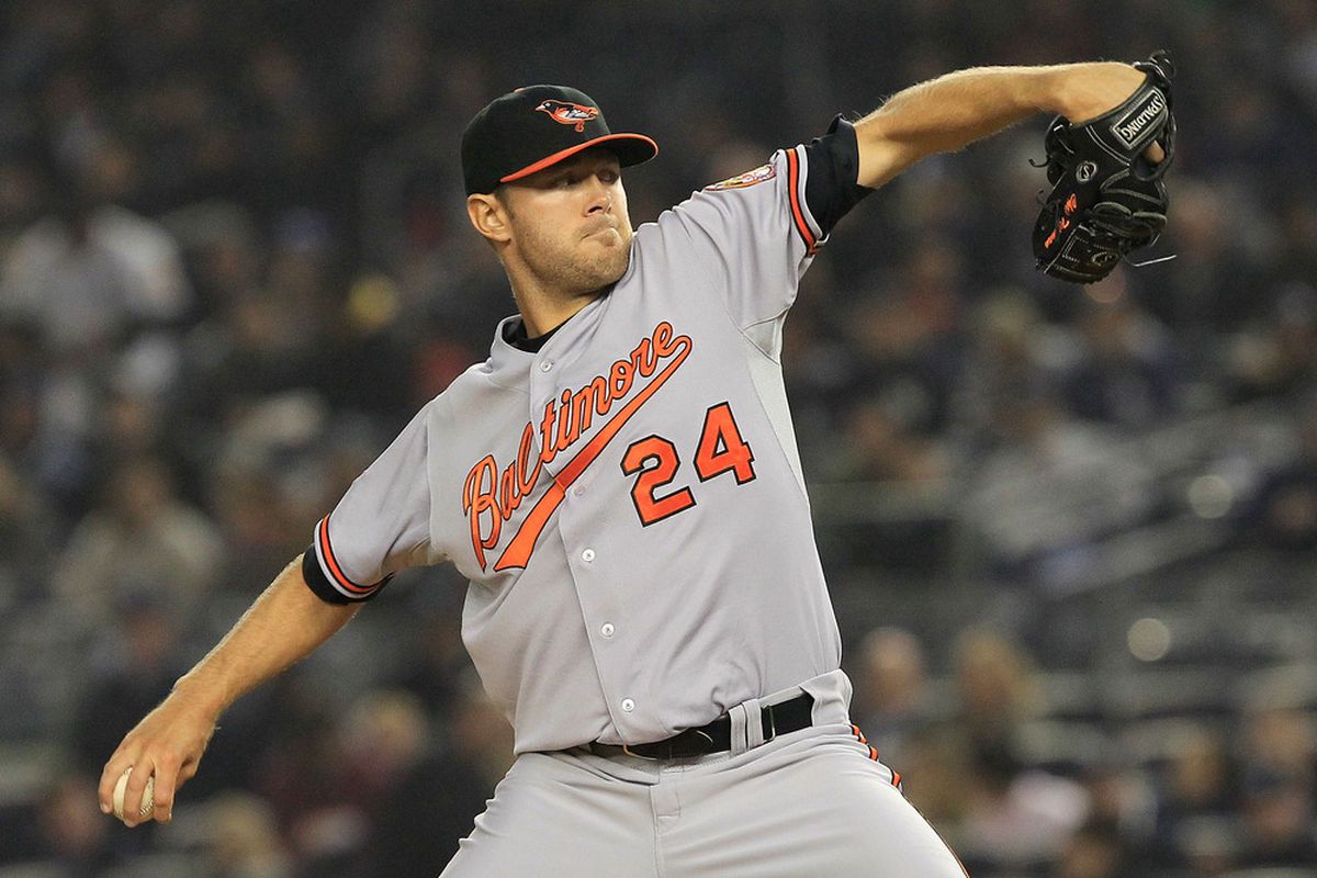 Chris Tillman #24 of the Baltimore Orioles pitches against the New York Yankees at Yankee Stadium.