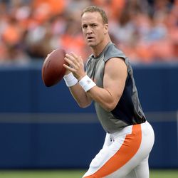 Peyton Manning prepares to throw during warmups