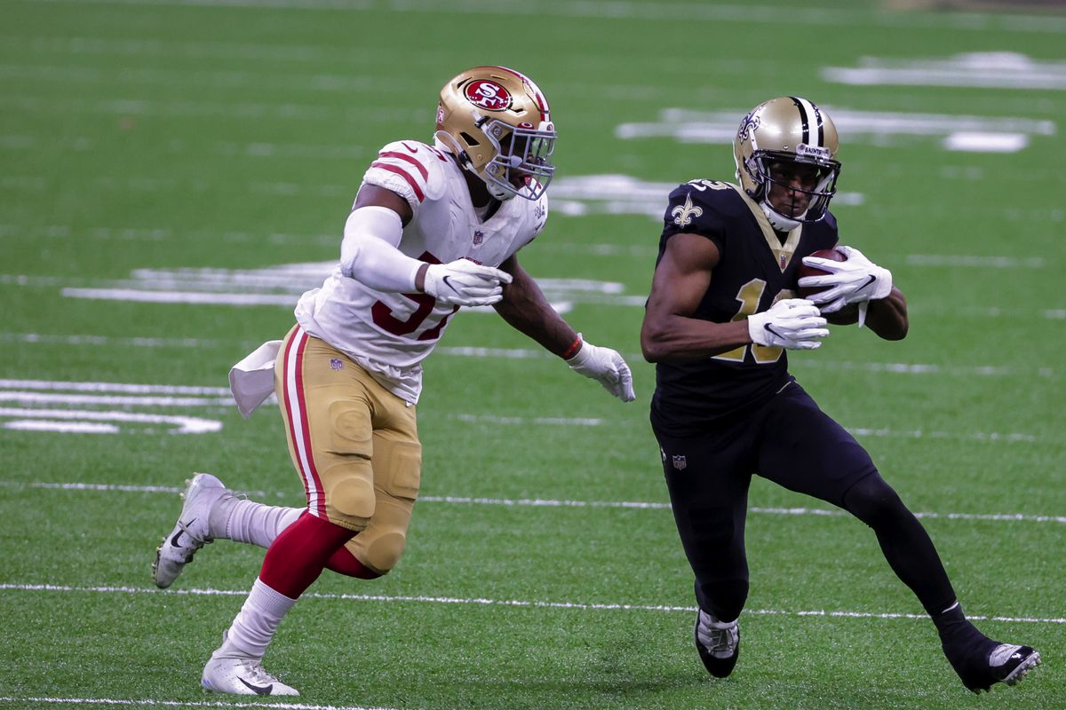 New Orleans Saints wide receiver Michael Thomas (13) runs from San Francisco 49ers linebacker Dre Greenlaw (57) during the second half at the Mercedes-Benz Superdome.&nbsp;