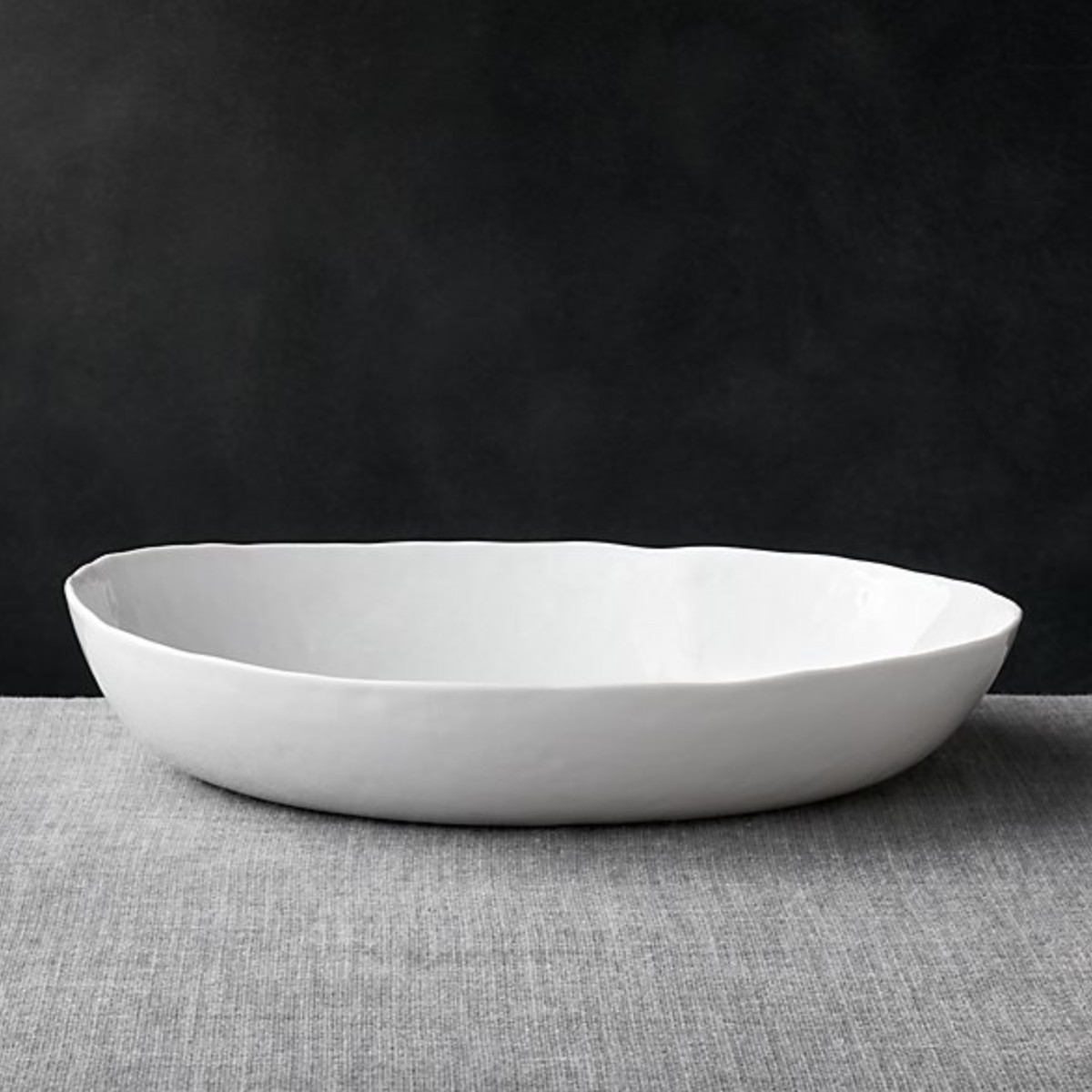 A white, oval shaped bowl. 