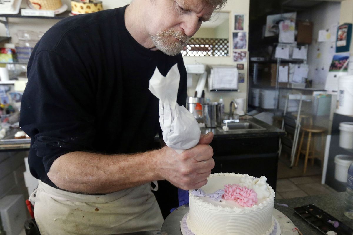 FILE - In this March 10, 2014, file photo, Masterpiece Cakeshop owner Jack Phillips decorates a cake inside his store in Lakewood, Colo. Prominent chefs, bakers and restaurant owners want the Supreme Court to rule against a Colorado baker who wouldn’t mak