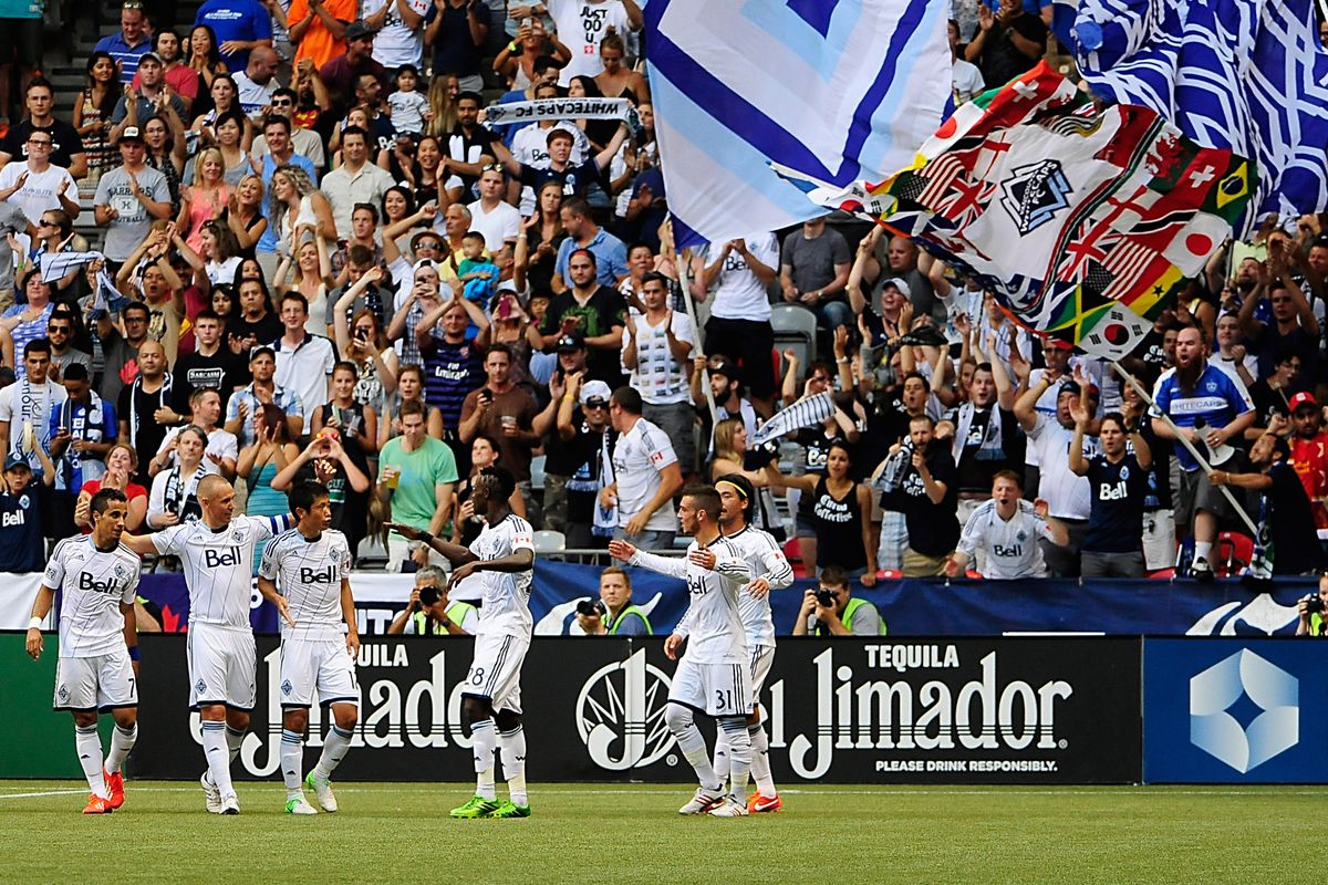 Kenny Miller and the Whitecaps celebrate scoring against the San Jose Earthquakes