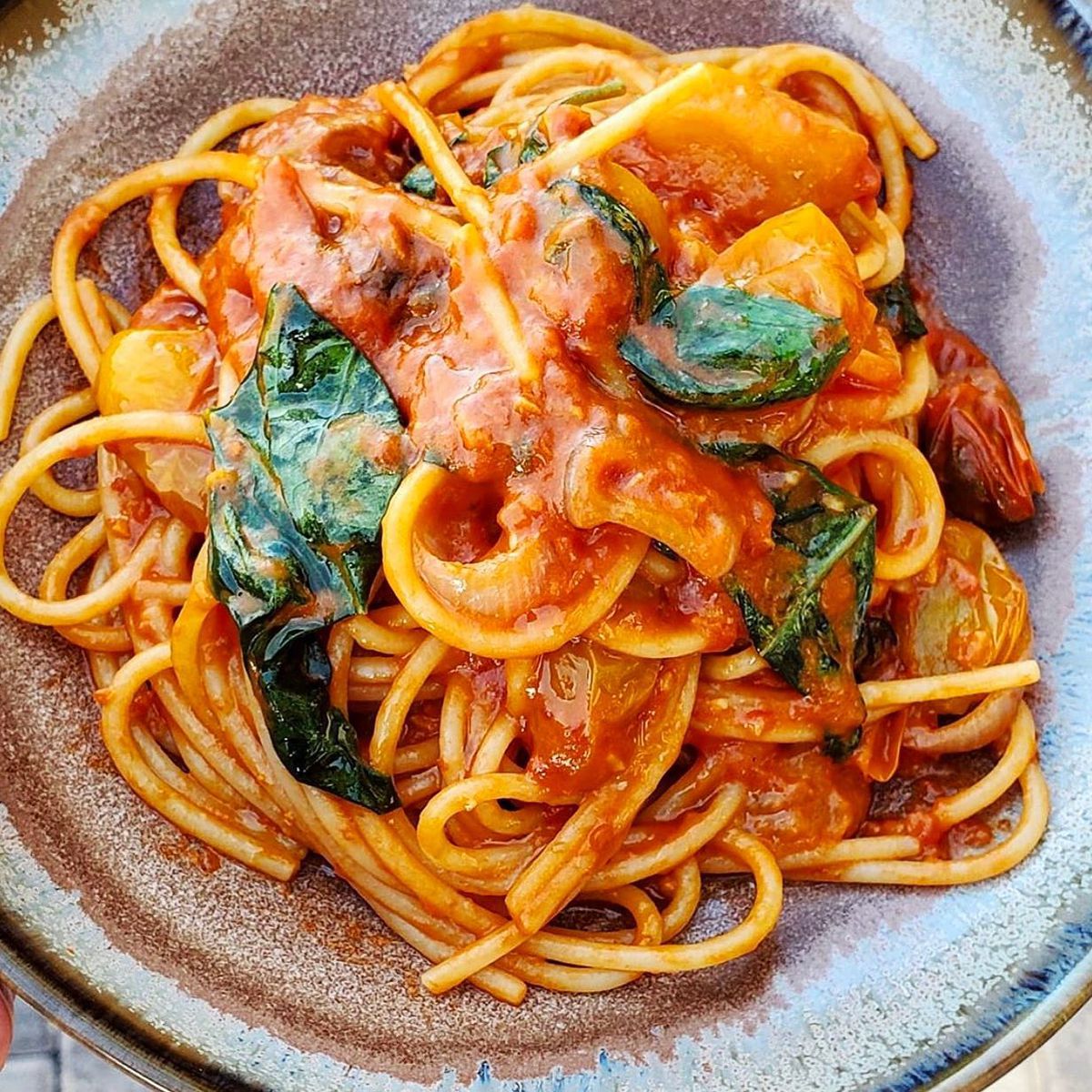 Spaghetti with a tomato sauce and basil