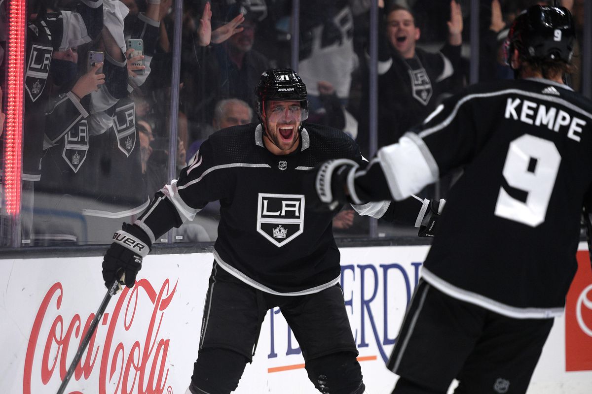 Oct 14, 2021; Los Angeles, California, USA; Los Angeles Kings center Anze Kopitar (11) celebrates with right wing Adrian Kempe (9) after scoring a goal during the second period against the Vegas Golden Knights at Staples Center.