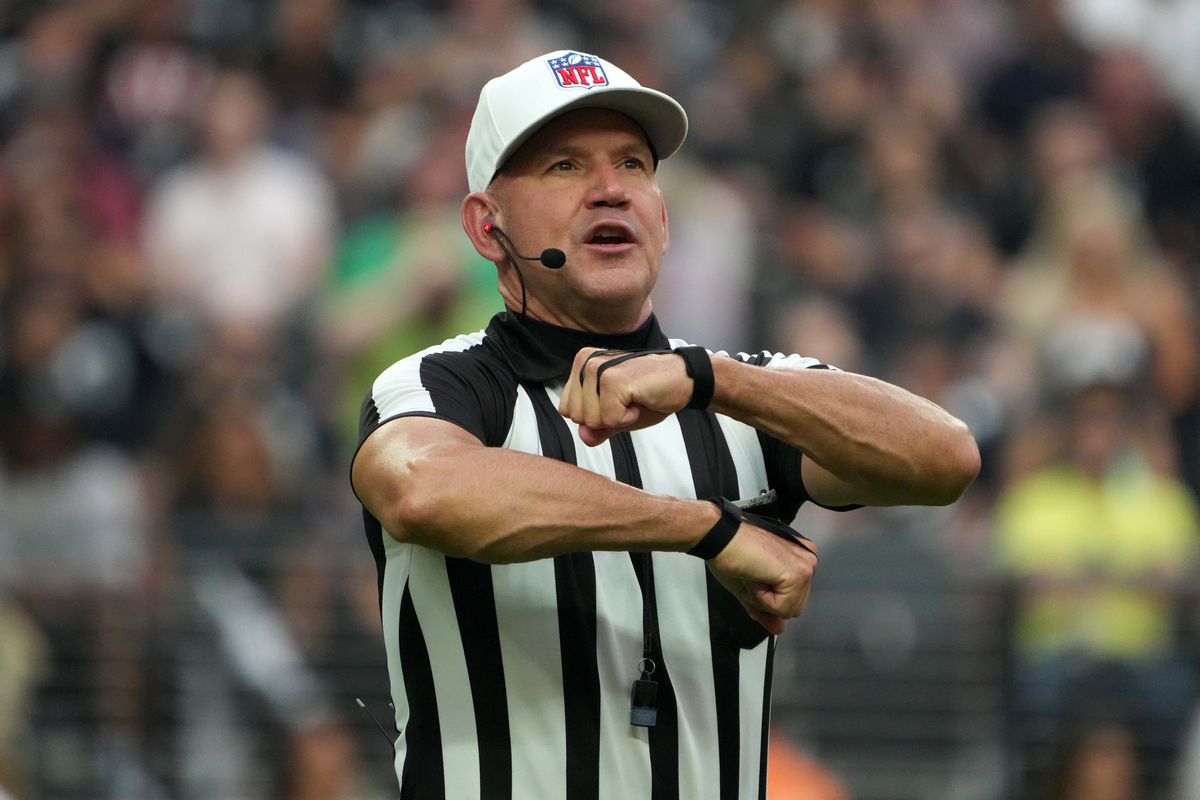 NFL referee Clete Blakeman (34) calls an illegal procedure penalty in the second half of the game between the Las Vegas Raiders and the Arizona Cardinals at Allegiant Stadium.