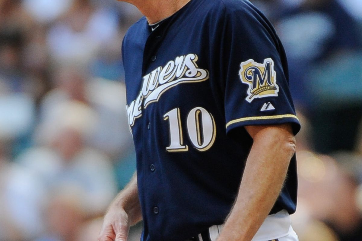 Sept 2, 2012; Milwaukee, WI, USA; Milwaukee Brewers manager Ron Roenicke visits the mound during the game against the Pittsburgh Pirates at Miller Park.  Mandatory Credit: Benny Sieu-US PRESSWIRE