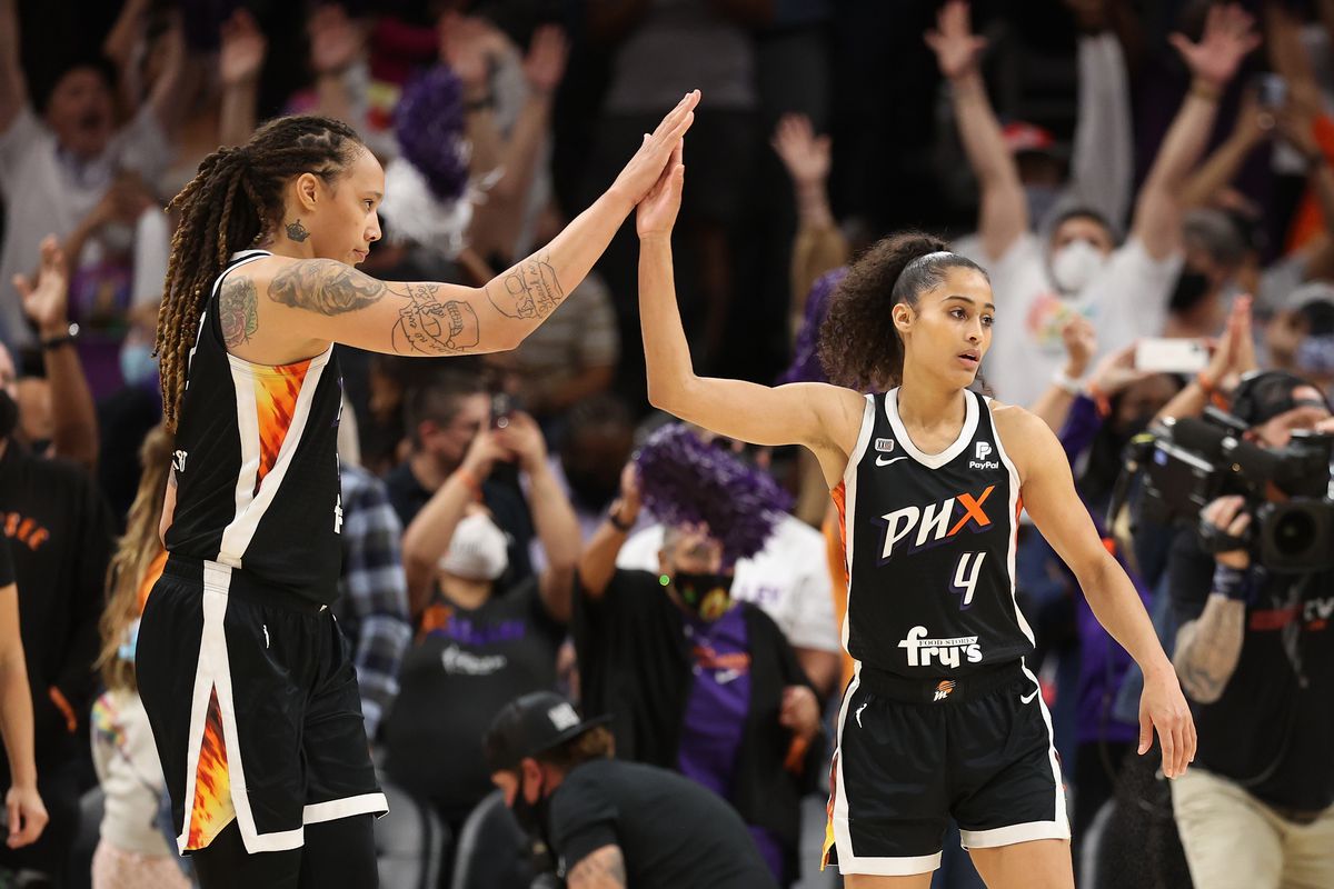 Brittney Griner #42 and Skylar Diggins-Smith #4 of the Phoenix Mercury celebrate after defeating the Chicago Sky in Game Two of the 2021 WNBA Finals at Footprint Center on October 13, 2021 in Phoenix, Arizona. The Mercury defeated the Sky 91-86 in overtime.