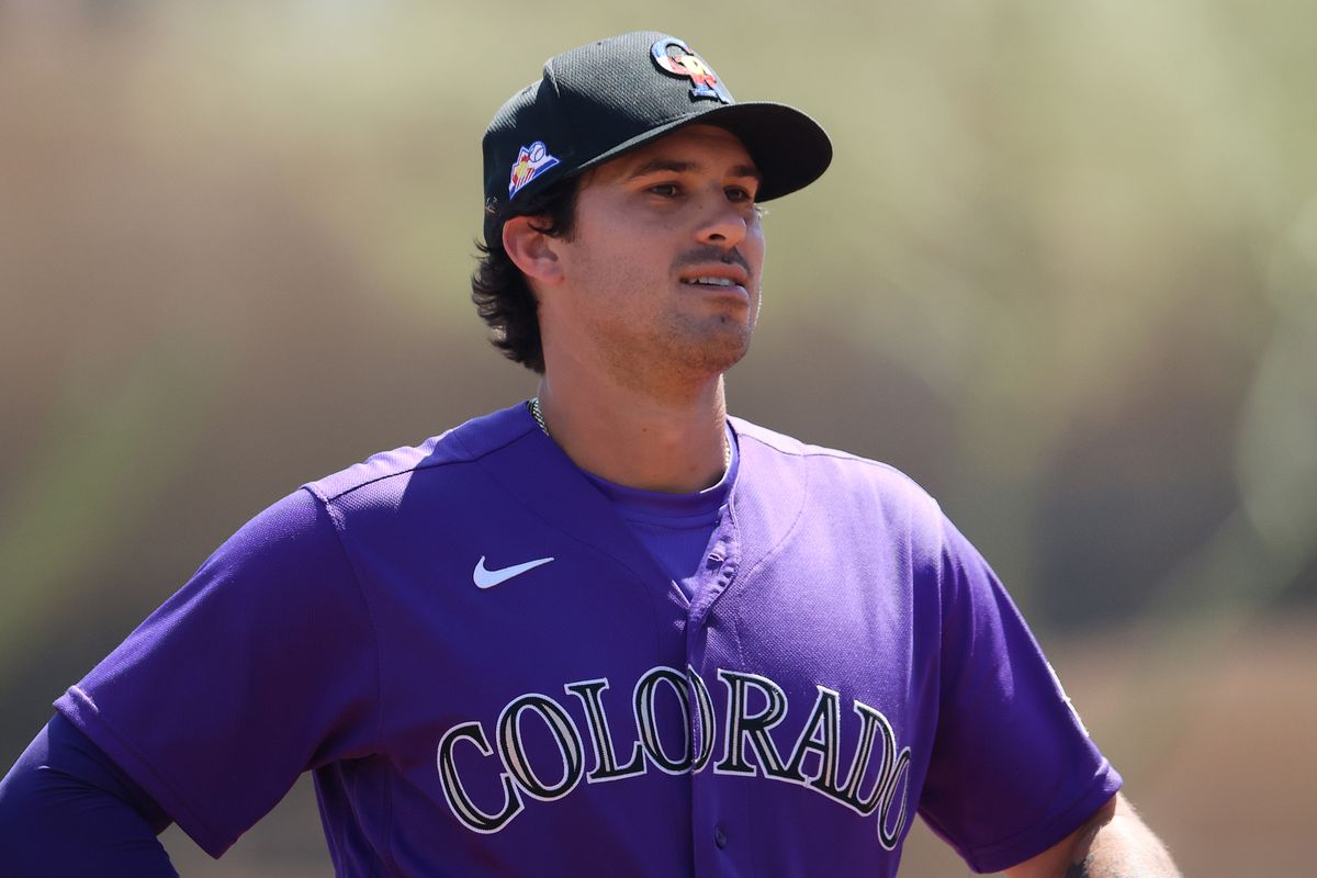 Josh Fuentes #8 of the Colorado Rockies looks on in the second inning against the Chicago White Sox during the MLB spring training game at Salt River Fields at Talking Stick on March 30, 2021 in Scottsdale, Arizona.